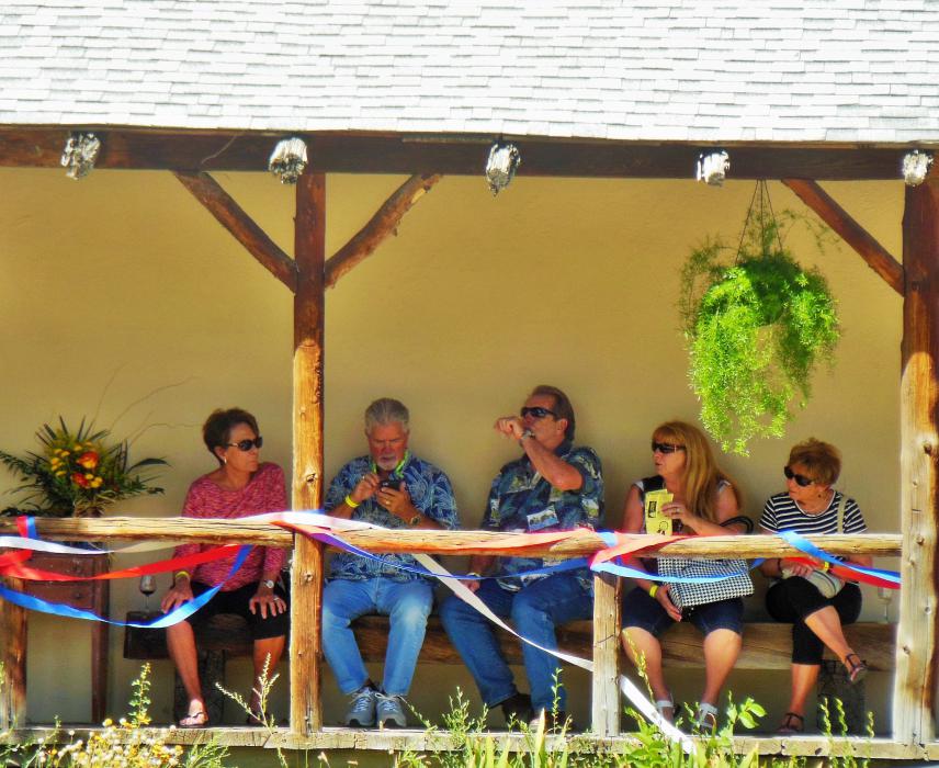 Guests enjoy the shade under the covered front porch of Carson City Art Gallery and Pottery Studio.