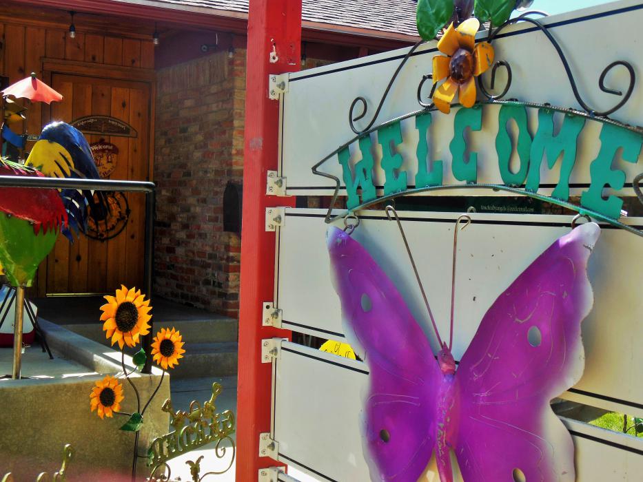 Welcome sign on the front gate to Touched By Angels.