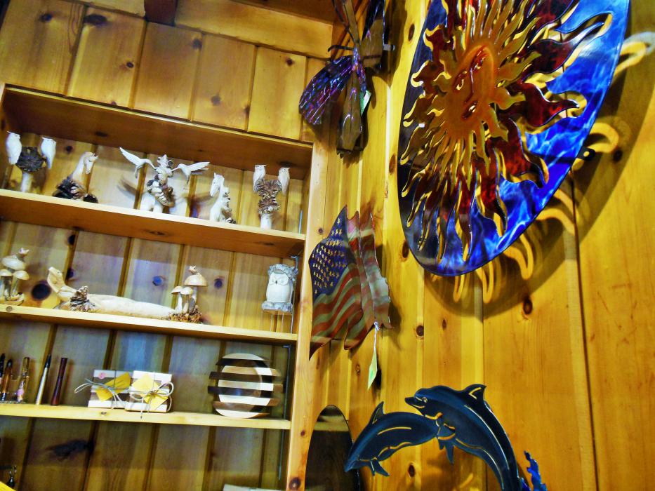 Metal wall art and sculptures in main front showroom.