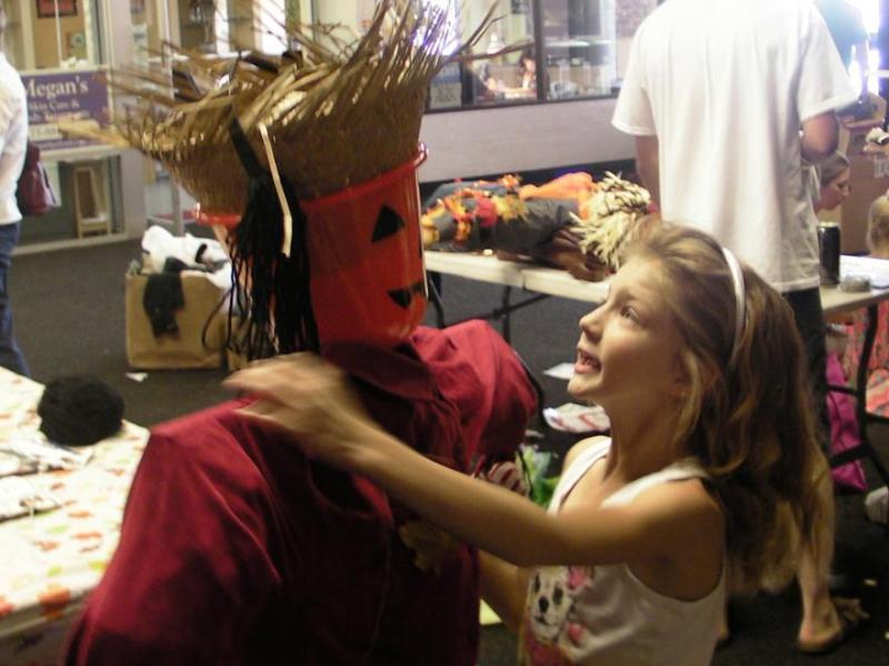 Laurel Griffith with her scarecrow 'Wilson" at the Carson Mall Scarecrow Festival Saturday in Carson City.