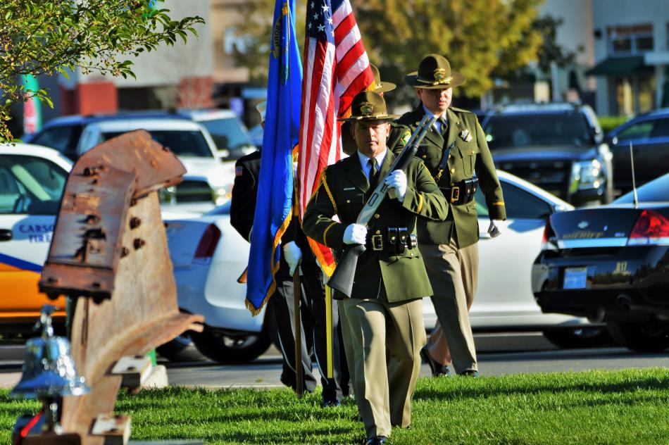 Presentation of the colors marching to the memorial Sunday morning at Mills Park.
