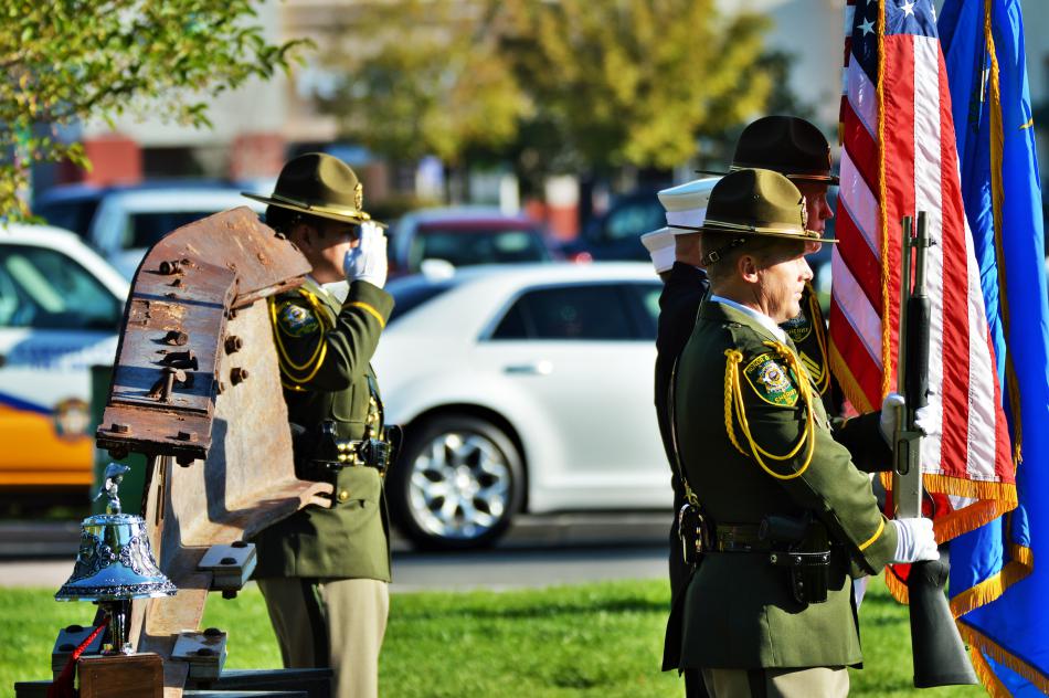 Color guard members of the Carson City Sheriff's Office and Fire Dept. salute during the National Anthem.