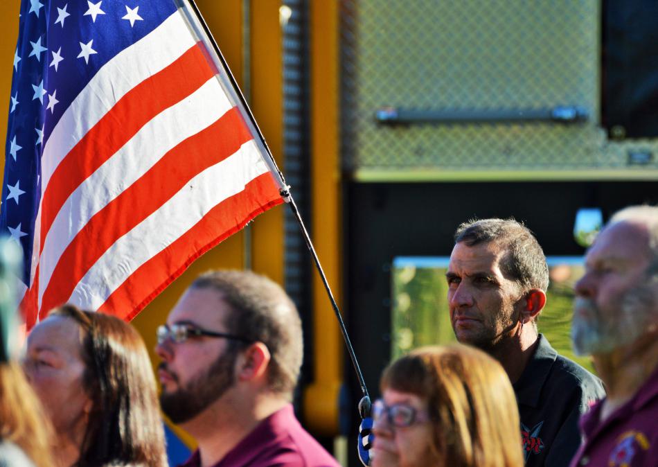 Tyrone Schultz of Carson CIty holds an American Flag during the 9/11 ceremony.