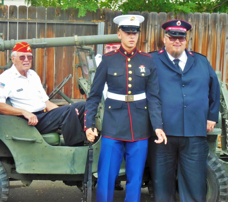 Josiah and Mark Cyr in front of a vintage USMC Jeep.