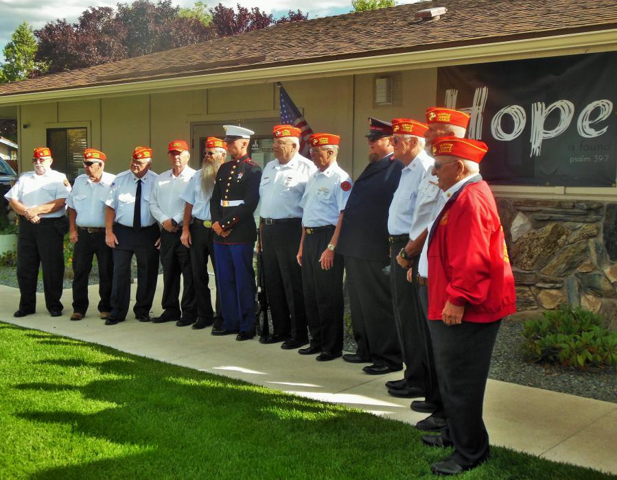 Josiah and Mark Cyr with members of the Marine Corps League in front of the Salvation Army Church.