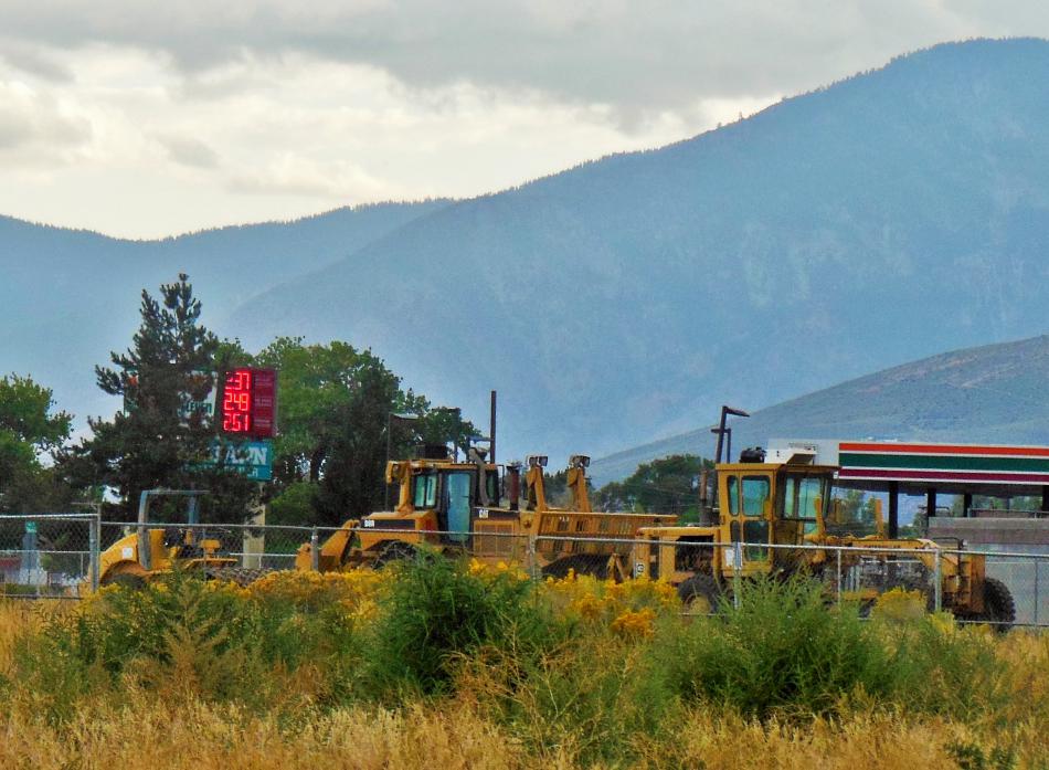 Heavy construction equipment is parked on the site of the future Maverik station.