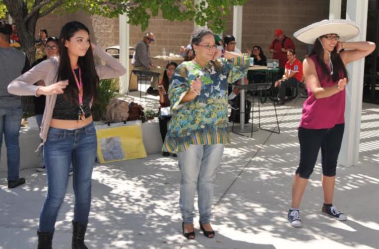 Brave students and faculty perform the Macarena.
