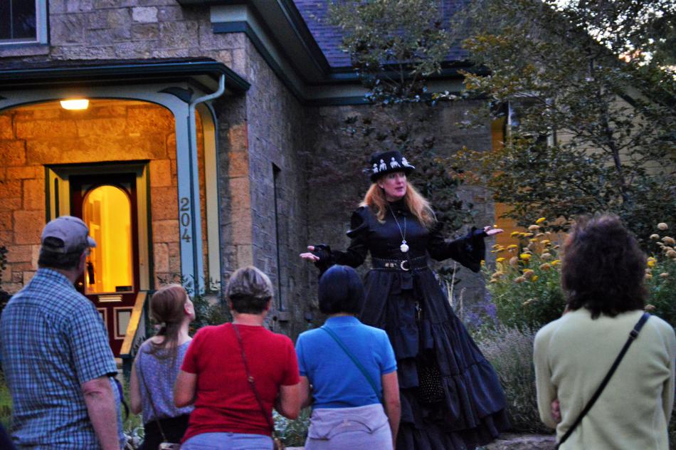 Madame Curry talking to tour guests in front of the Edwards House.