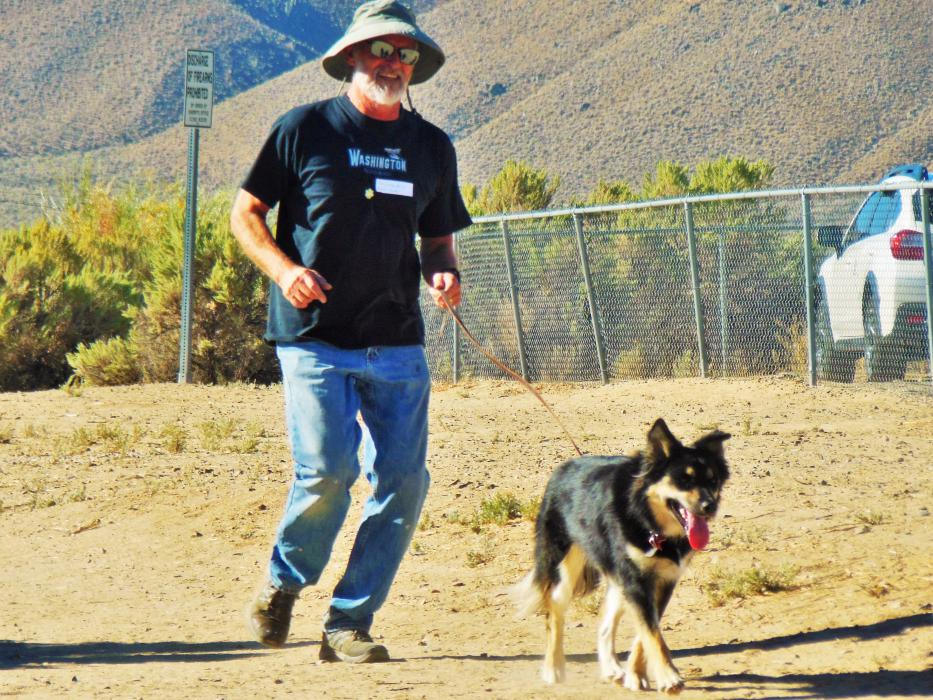 A dog and its human participate in the 5K9 event Sunday at Riverview Park.