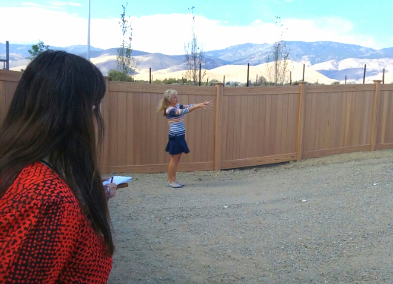 Lisa Schuette (right) talks about an outdoor area adjacent to the shelter building.
