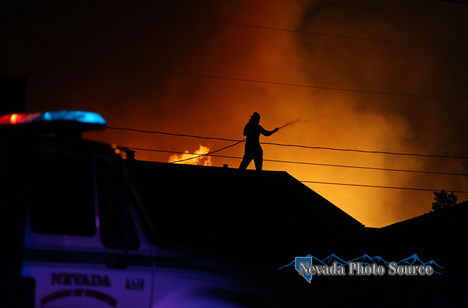 Firefighters try to hold the wildfire burning in South Carson City. Cathleen Allison, Nevada Photo Source