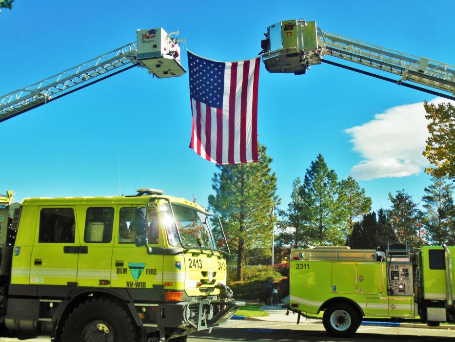 The American flag facing east toward the Nevada Firefighters Memorial.