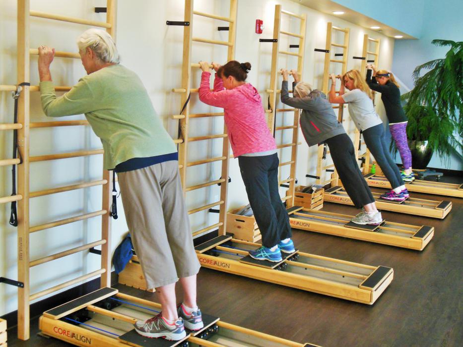 Clients work on their core during class inside the studio at Ascent Physical Therapy.