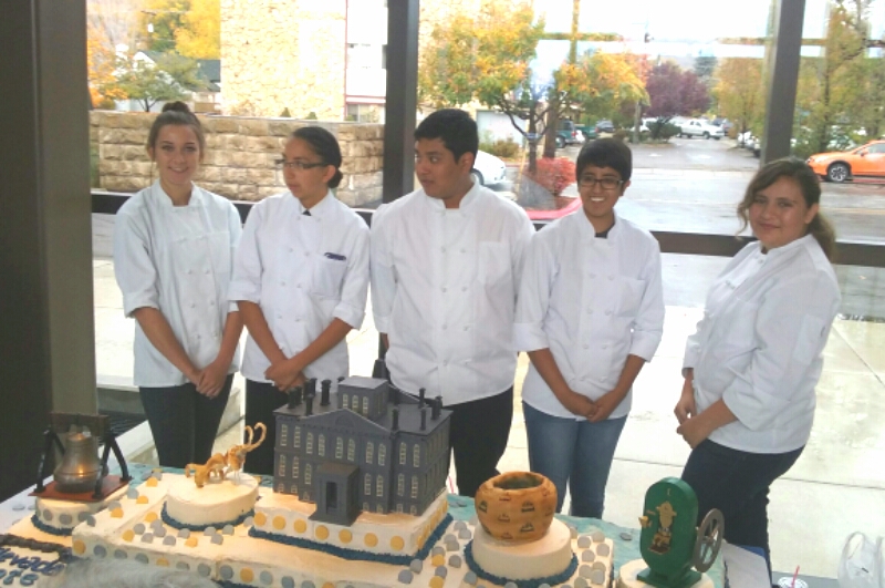 Photos by Brett Fisher. CHS culinary students with their 75th anniversary cake.