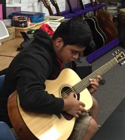 Student Plays Guitar in a PHS Class