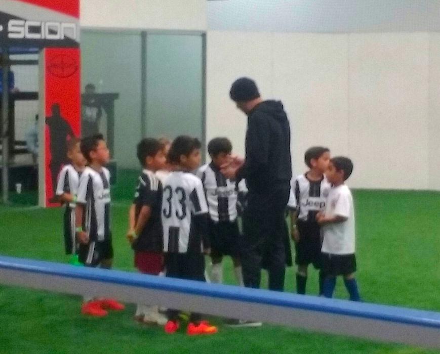 Shams Mobaligh on the field with his youth soccer team at TAC.