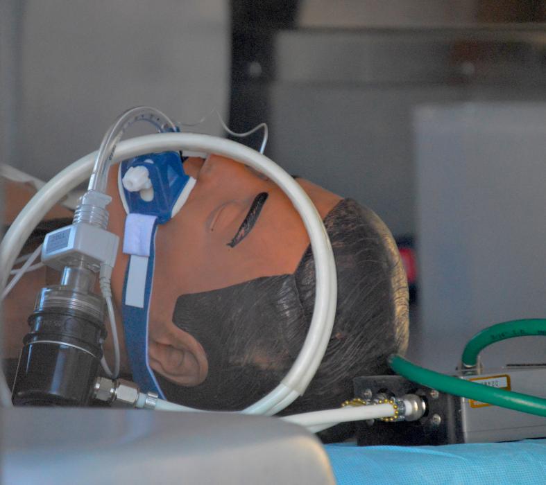 Cardiac simulation dummy in the back of an ambulance.