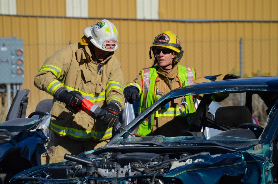 A glass saw is used to cut away shards of broken windshield during a mock extraction.
