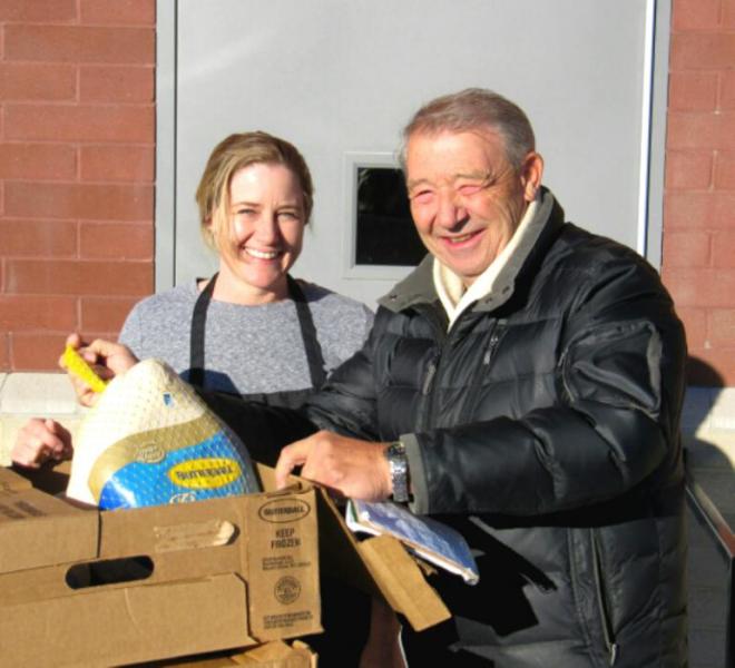 Photos courtesy Downtown Coin Club. Coin Club MVP John Syrotynski with Tammy at the senior center kitchen.