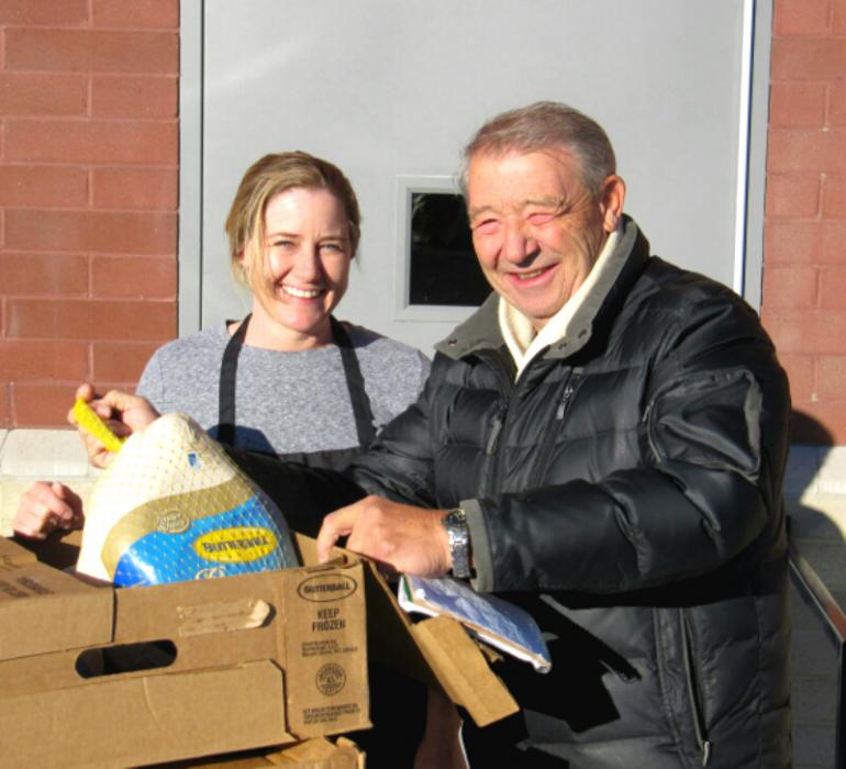 Photos courtesy Downtown Coin Club. Coin Club MVP John Syrotynski with Tammy at the senior center kitchen.