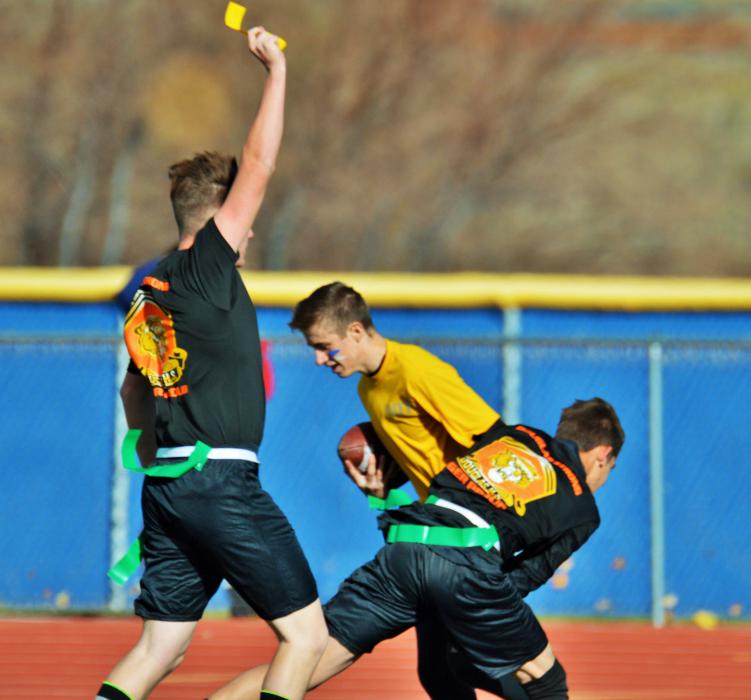 A Douglas Army defender pulls the flag off a Navy ball carrier.