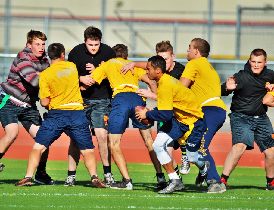 Navy quarterback takes the snap Saturday against Douglas.
