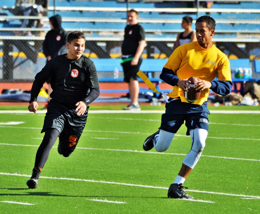 A Douglas defender chases down the Carson Navy quarterback.