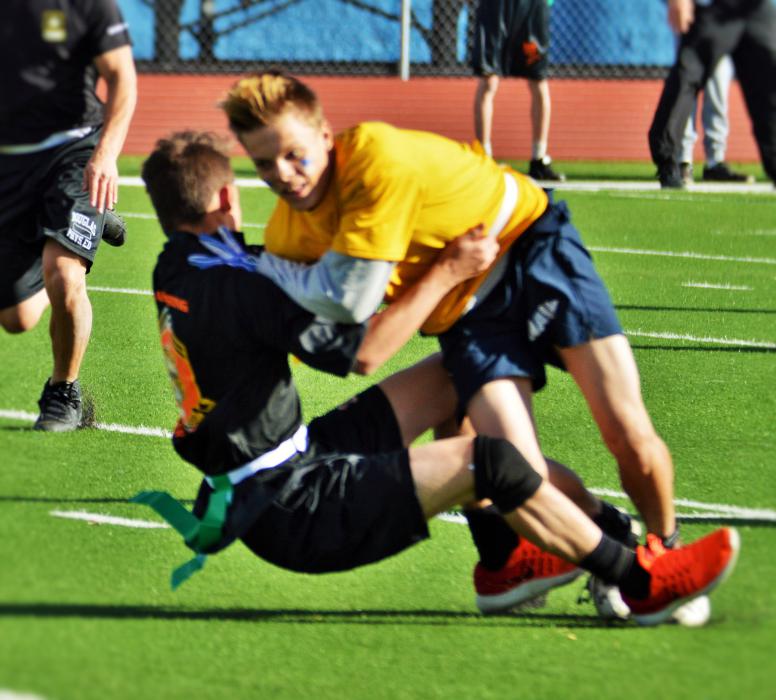 Carson High ball carrier runs into a Douglas defender to gain a first down.