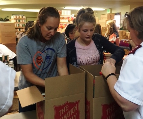 Ann Brit and Hannah Kaiser volunteering at the Salvation Army Church.