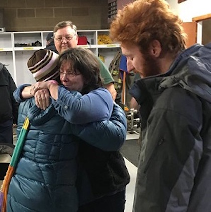 Susan Holloter (L) being hugged by sister Sondra Winberry after the ordeal. Susan's son Dustin Cudd is on the right.