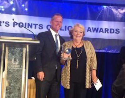 Lieutenant Governor Mark Hutchinson presented Kathy McIntosh with a Governor's Points of Light Award