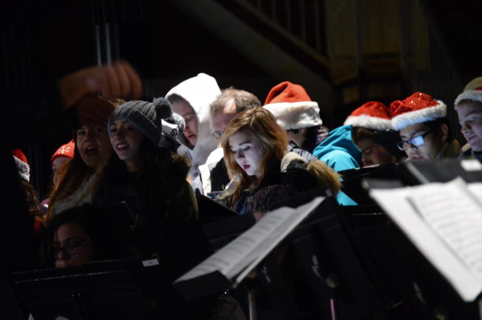Carson High Chamber Choir sings on McFadden Plaza Friday night.