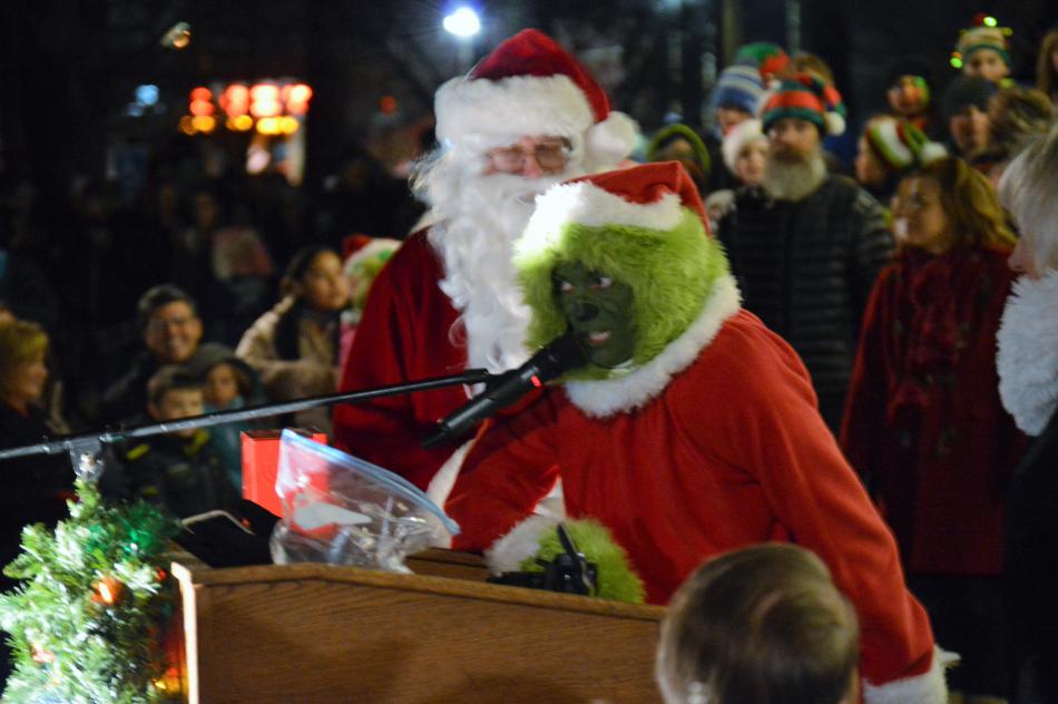 The Grinch seeks his award at the tree lighting ceremony.