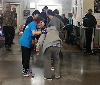 Gloria Navarro encourages a classmate at Rock Steady Boxing.