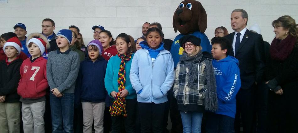 Carson City Mayor Bob Crowell and Supervisor Karen Abowd sing 'Frosty the Snowman' with students from Empire Elementary.