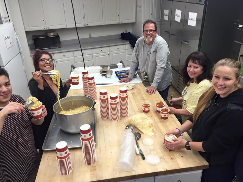Photos courtesy NNDC. Volunteers in the kitchen preparing a hot meal.