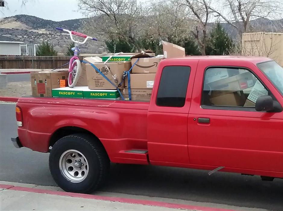 A pickup truck filled with donations from EVMS.