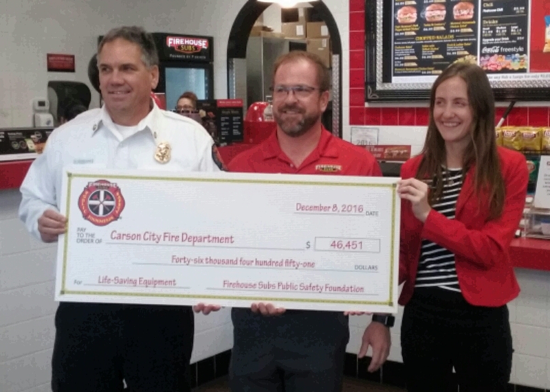 Photos by Brett Fisher. CCFD Chief Schreihans (left), Damon Kreizenbeck, Jackie Gubbins.