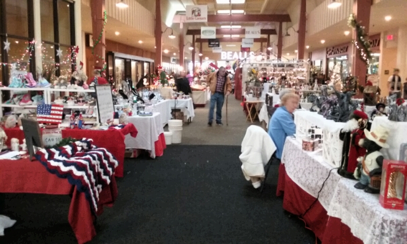 Rows of crafters provide holiday spirit inside the Carson Mall.