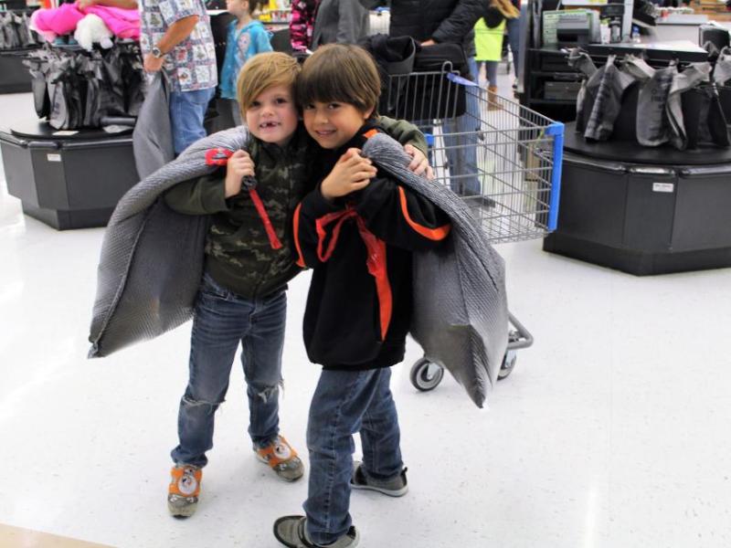 Jaden and Nicholas, Boys & Girls Club members from Carson Valley, finished their shopping and were headed out to visit Santa.