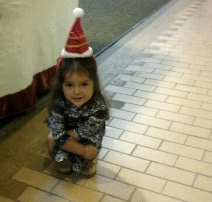 A festive young holiday shopper inside the Carson Mall.