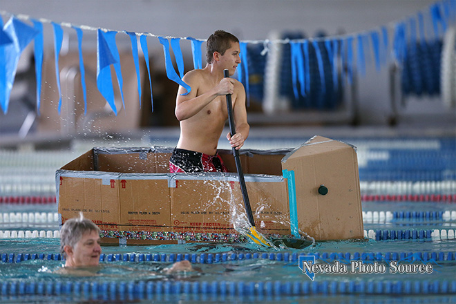 Nathan Gonzales, 18, with Carson High School Naval Junior ROTC, paddles a cardboard vessel across the pool.