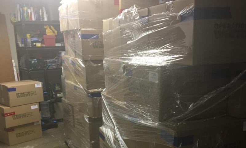 Two pallets filled with American union-made coats, wait for distribution to their new homes with Douglas County school children.