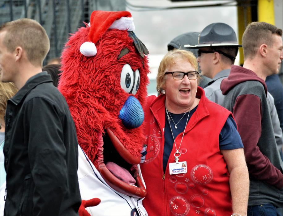 Reno Aces mascot Archie with volunteers at Holiday with a Hero Wednesday.