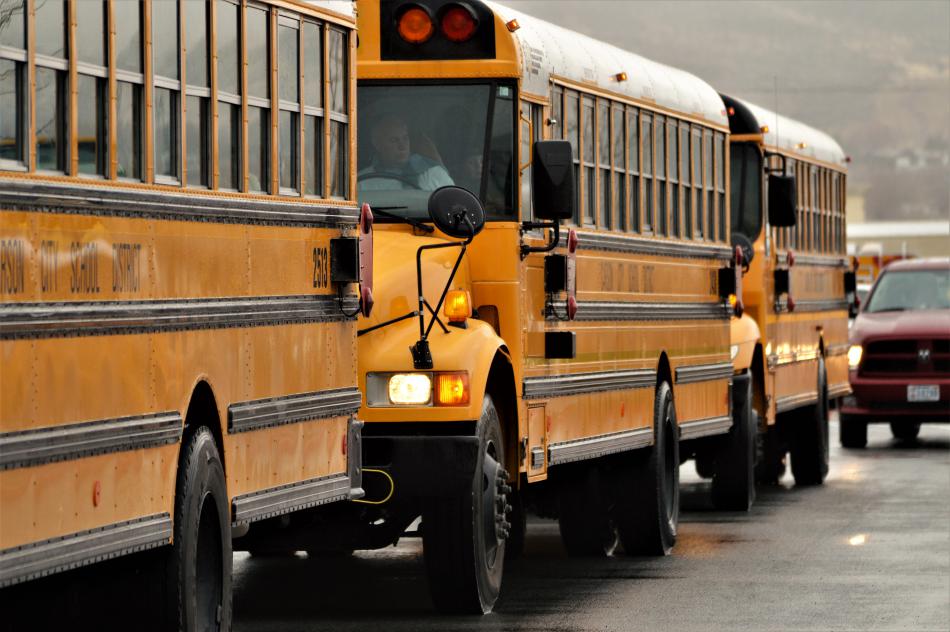 School buses arrive at Wal-Mart in North Carson City Wednesday morning.