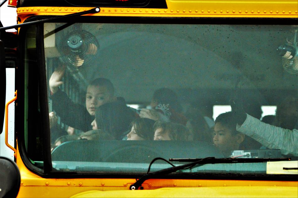 Children aboard a school bus wait to disembark at Wal-Mart Wednesday morning.