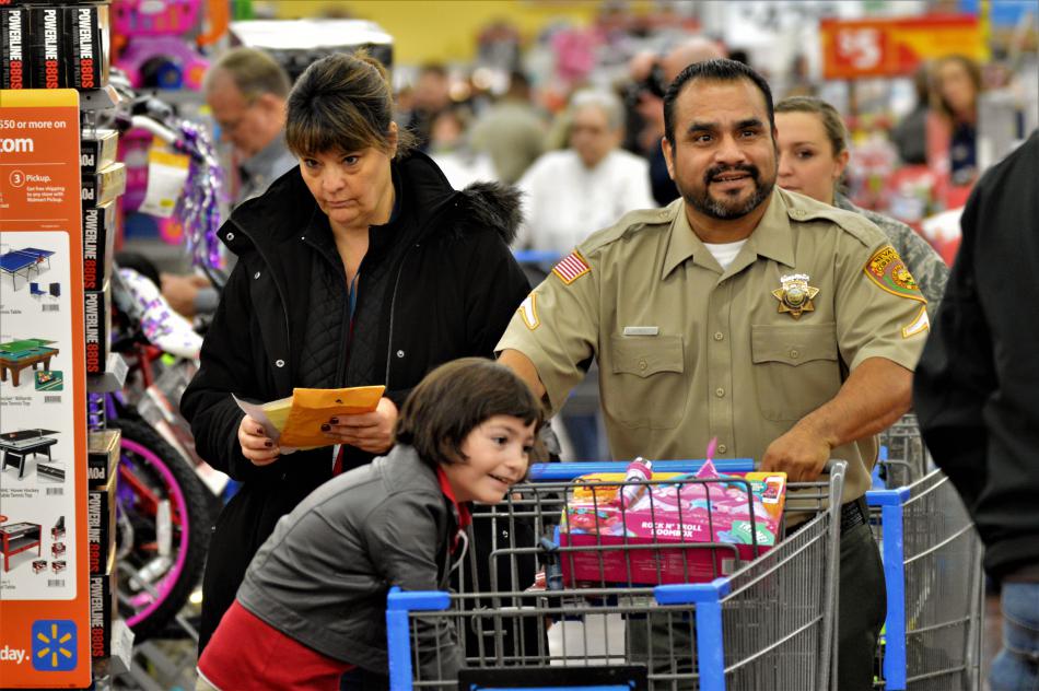 A Nevada DOC officer and a girl shop at Wal-Mart Wednesday.