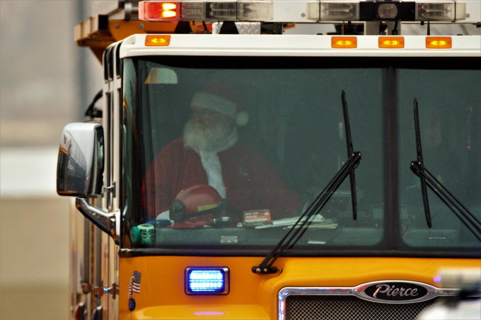 Santa Claus arrives Wednesday morning aboard a Carson City Fire Dept. engine.