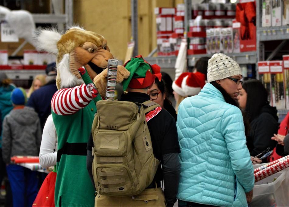 Holiday with a Hero volunteers, including the WNC mascot.