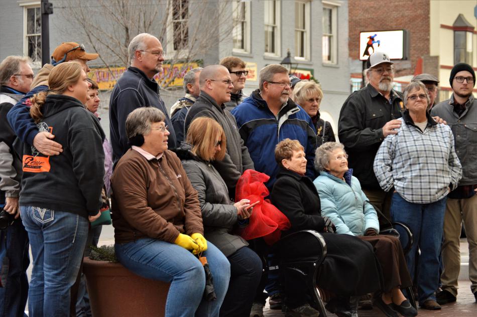 Photos by Brett Fisher. Members of the Harold Berger family gather to dedicate a bench Wednesday afternoon.